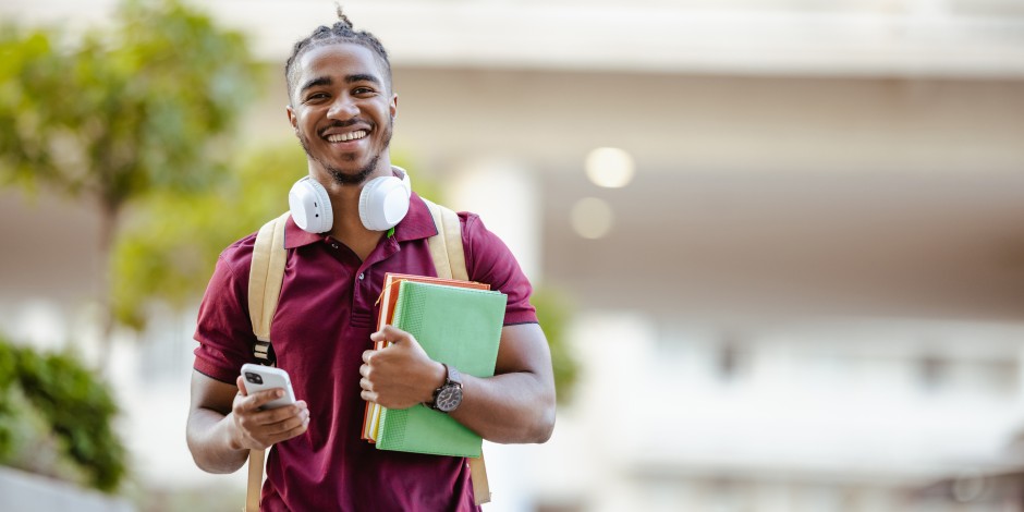 A college student makes his way across campus